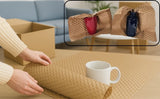 Papier bulle kraft utilisé pour emballer de la vaisselle ou la décoration fragile pendant un déménagement, solution écologique et anti-casse